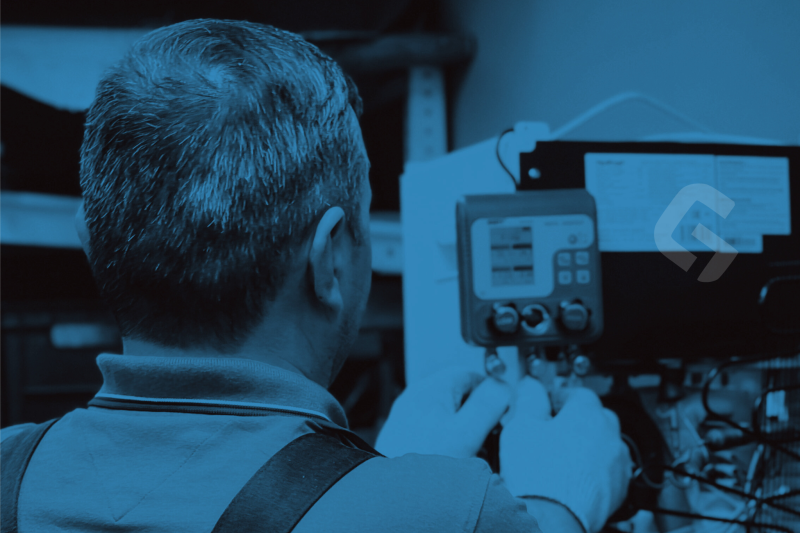 Technician performing HVAC system diagnostics using digital measurement tools